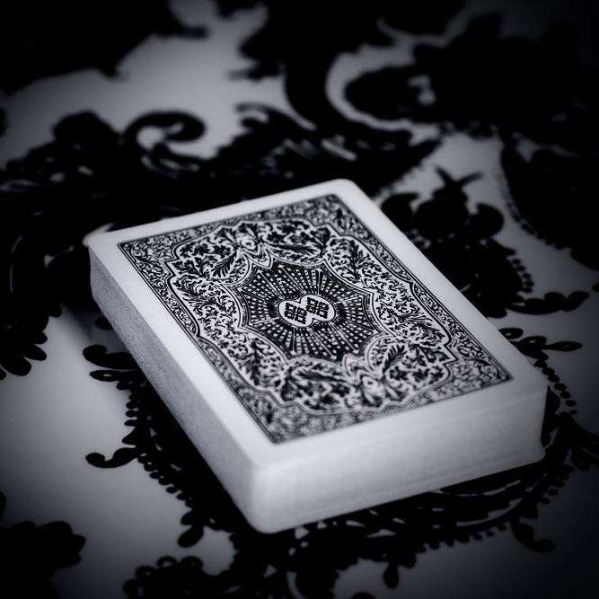 Decorative white Arrco deck with intricate black patterns on a dark background