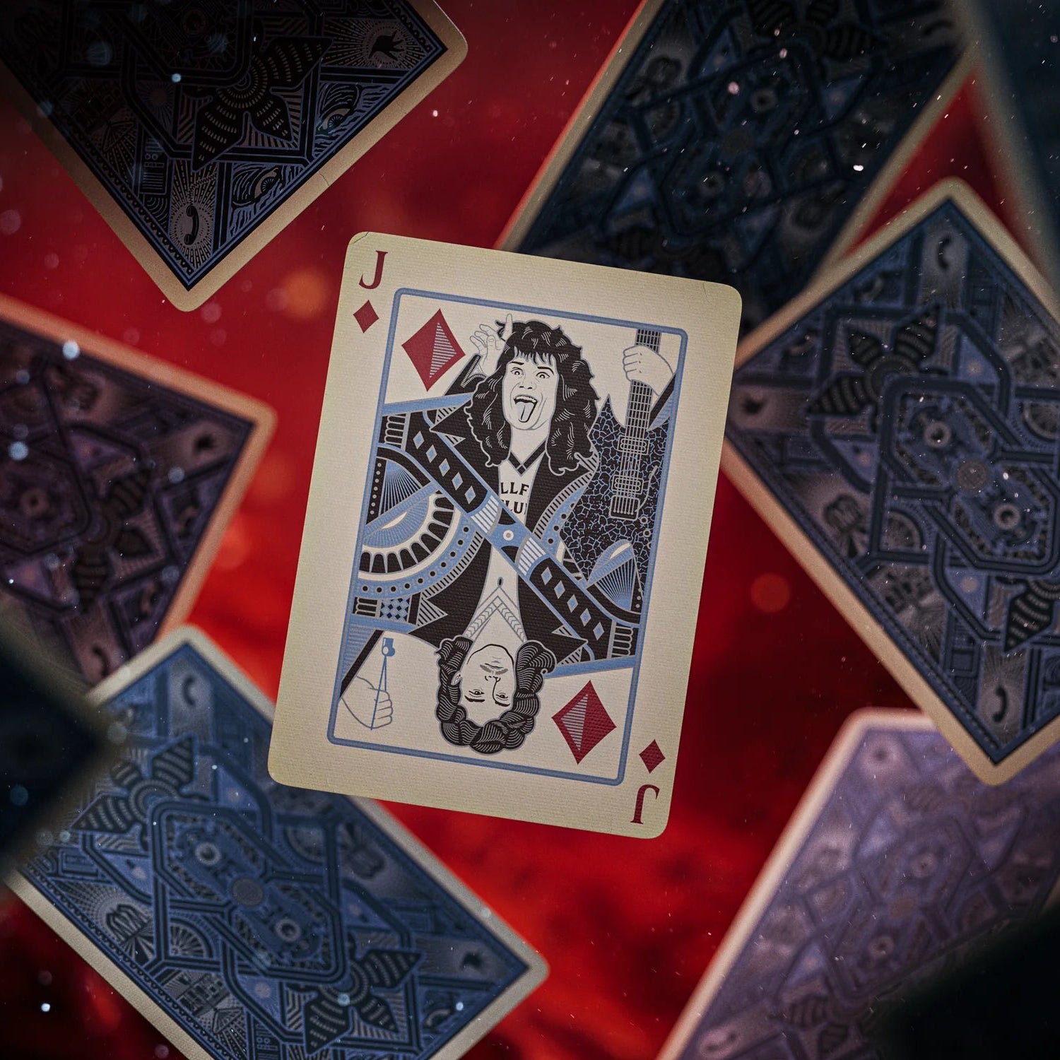 Jack of Diamonds Stranger Things Hive Mind playing card on a red and blue patterned surface
