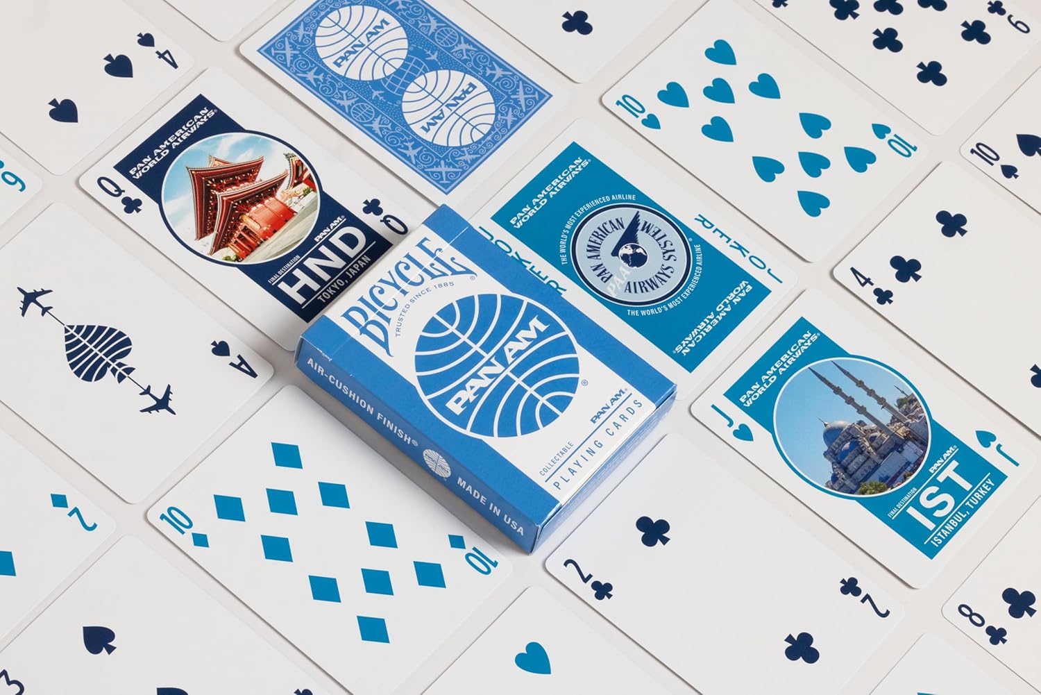 Bicycle Pan Am playing cards with blue and white design on a white surface