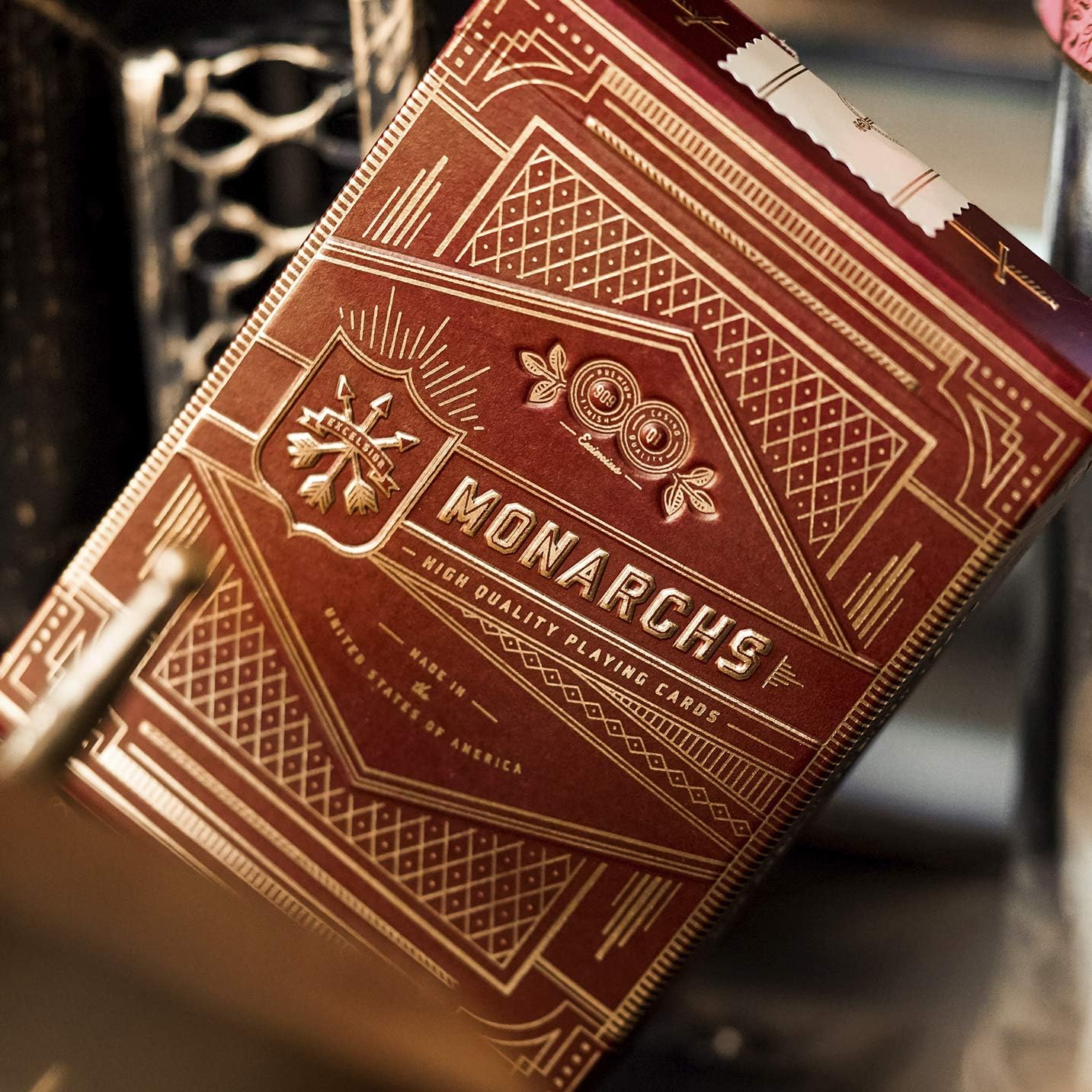 Monarch playing cards with intricate design on a blurred background