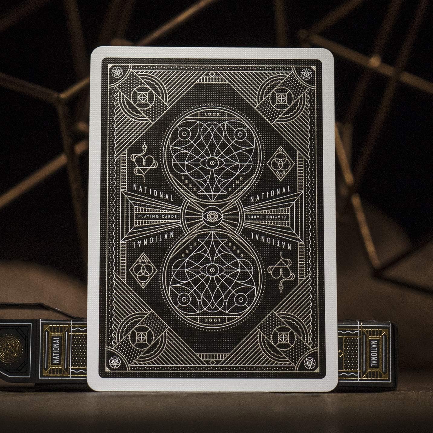 Playing card with intricate design on a dark background