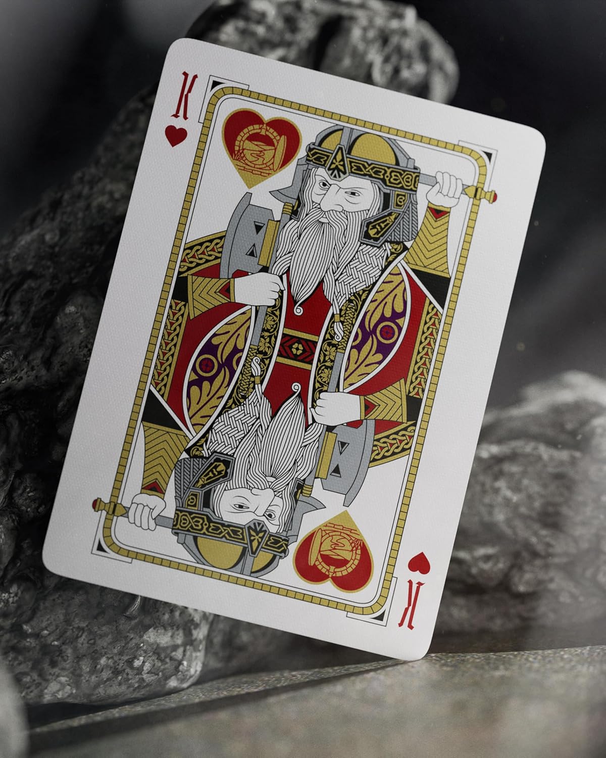 King of Hearts playing card on a textured surface