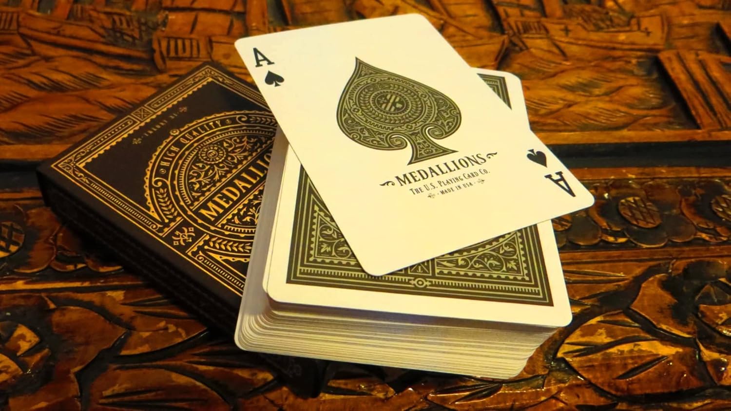 Playing cards with 'Medallions' branding on a wooden surface