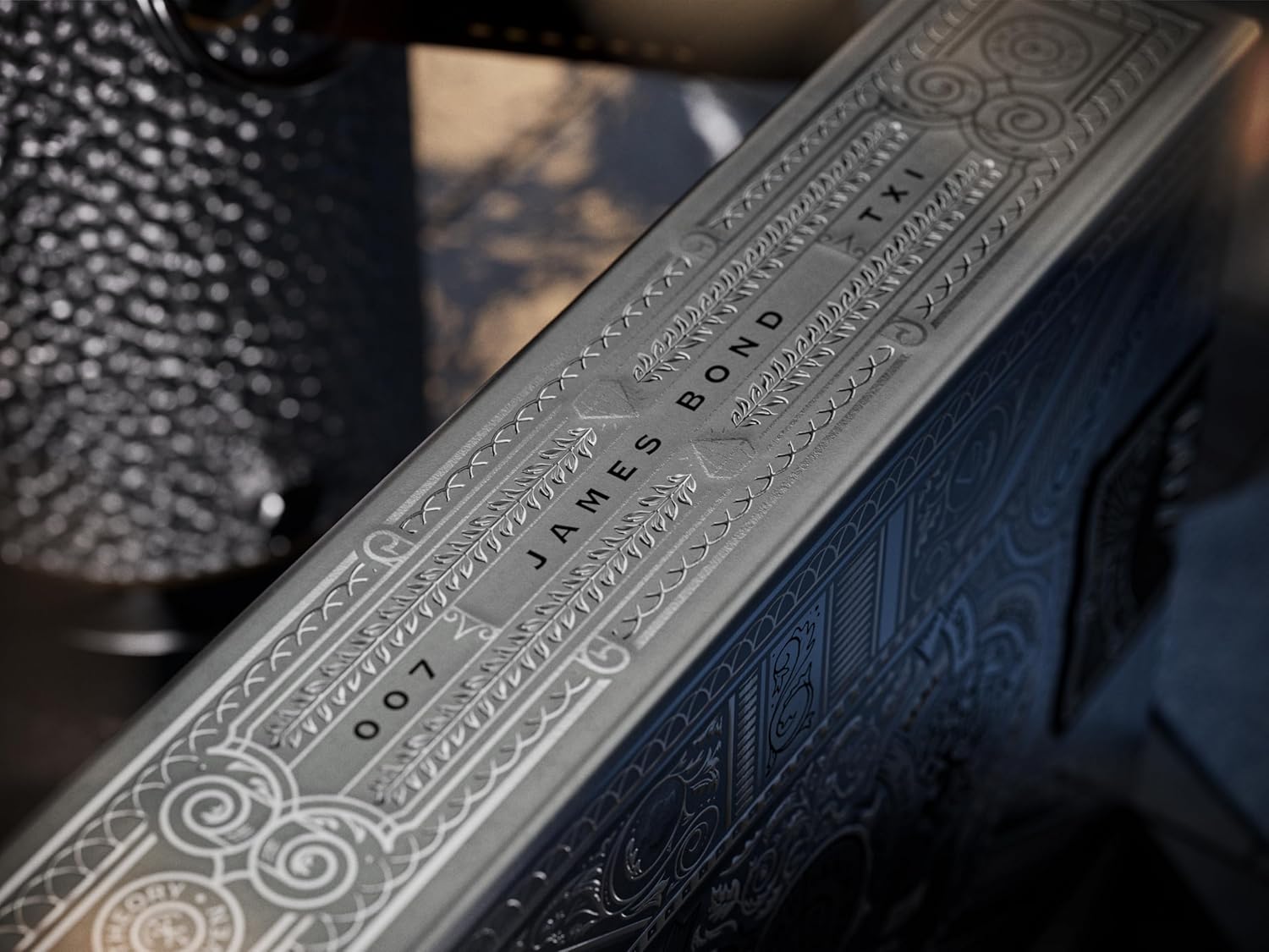 Close-up of a James Bond book with intricate embossed text and design.