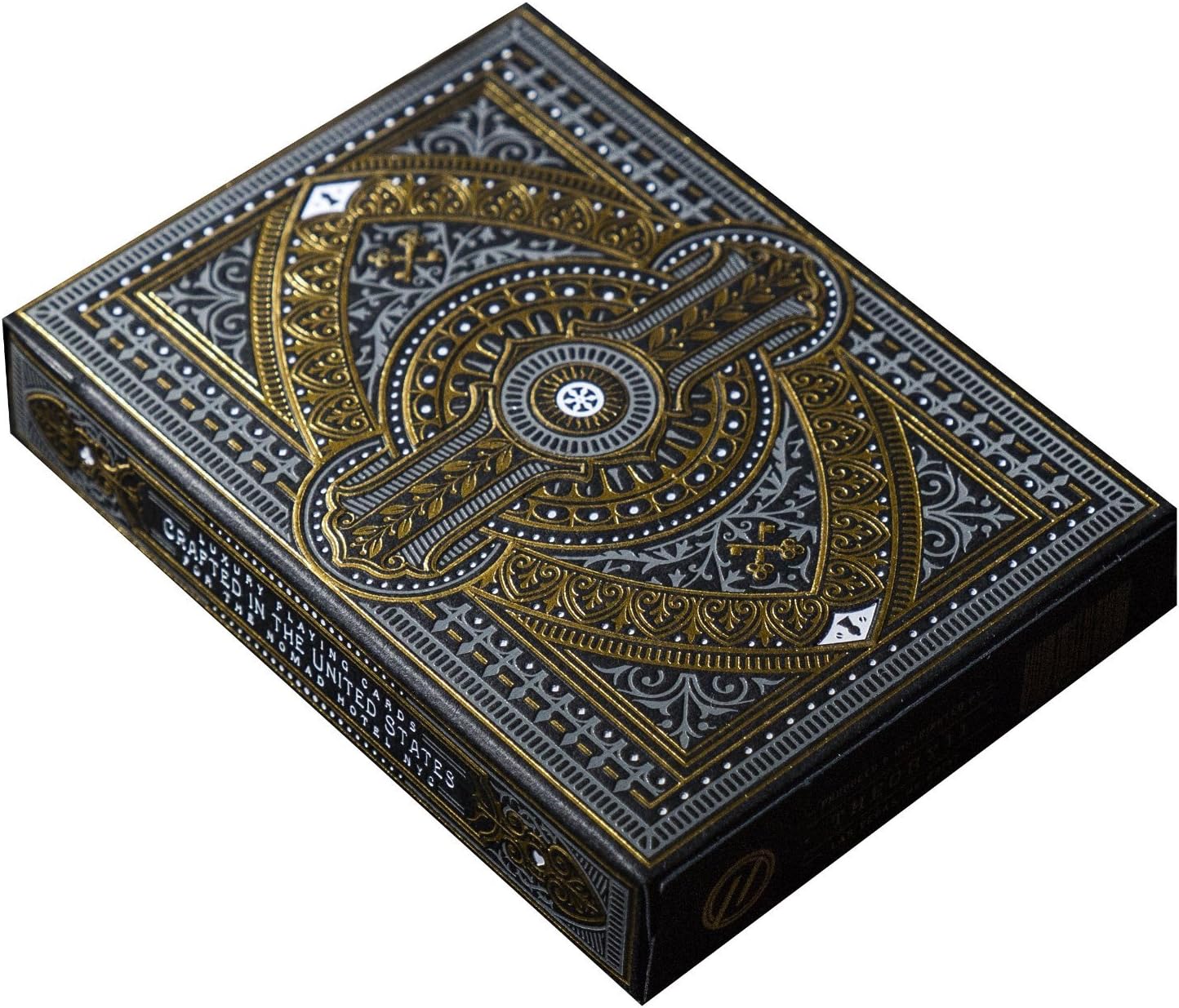 Decorative playing card box with intricate gold and silver design on a white background