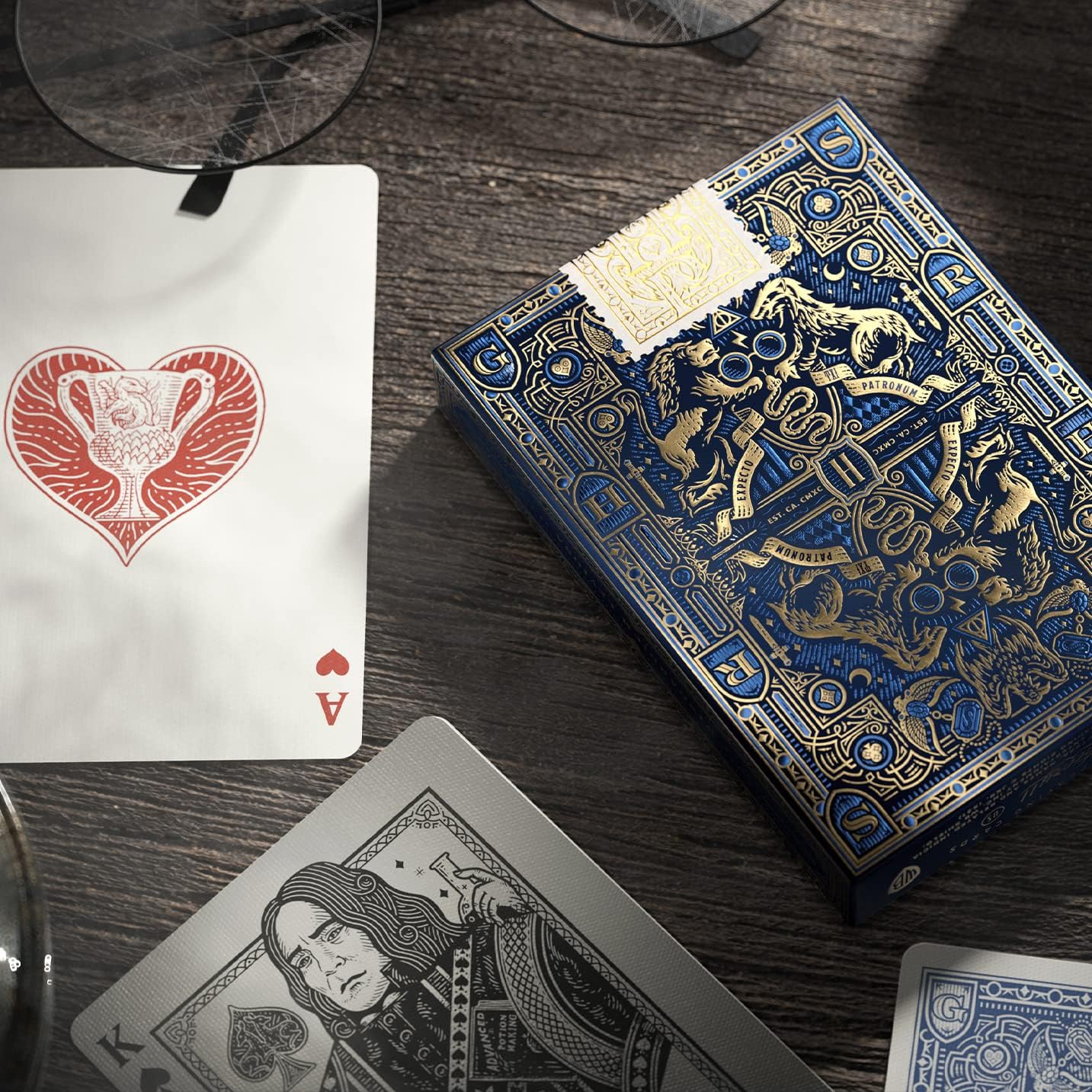 Decorative playing cards with intricate designs on a wooden surface