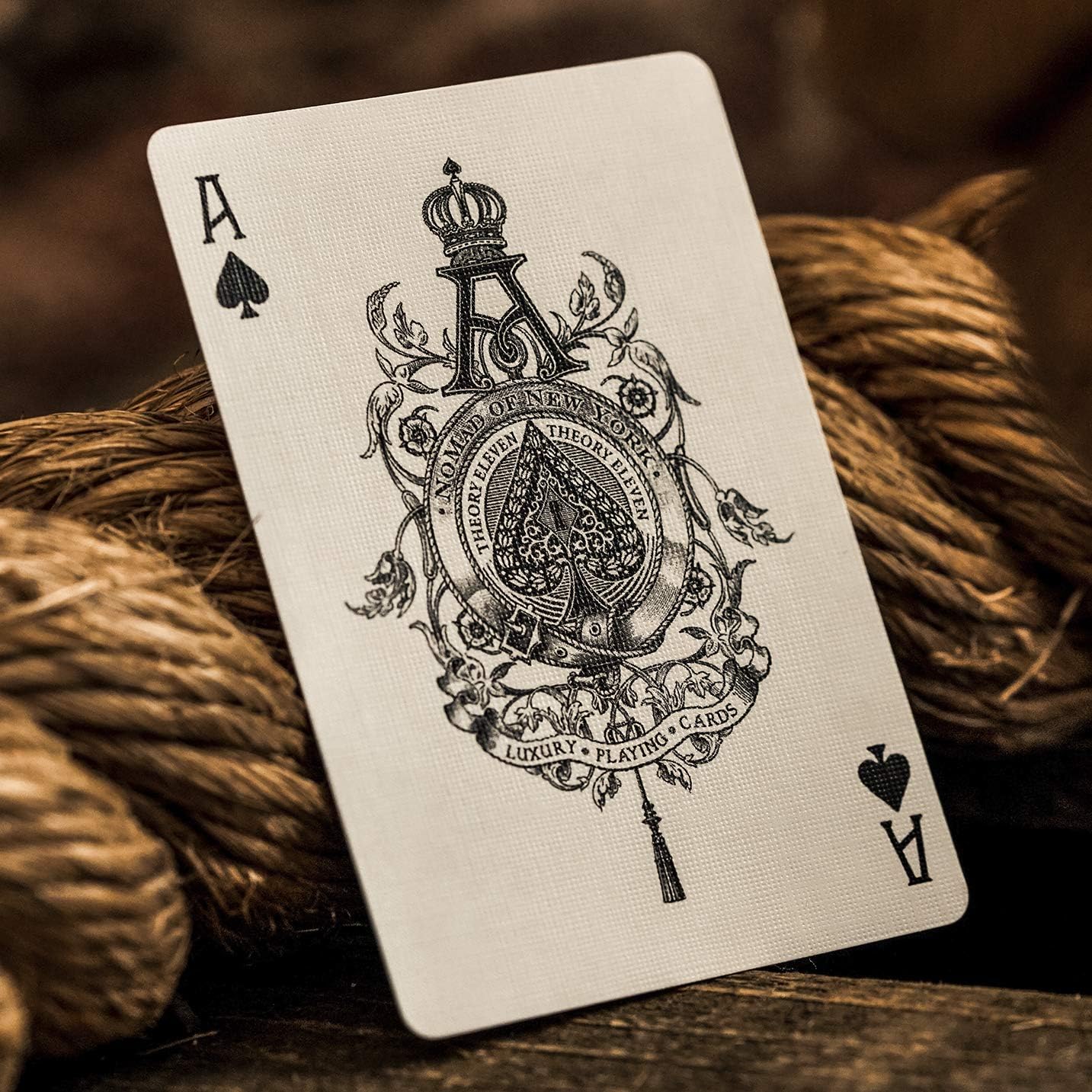 Playing card with intricate design on a rope background