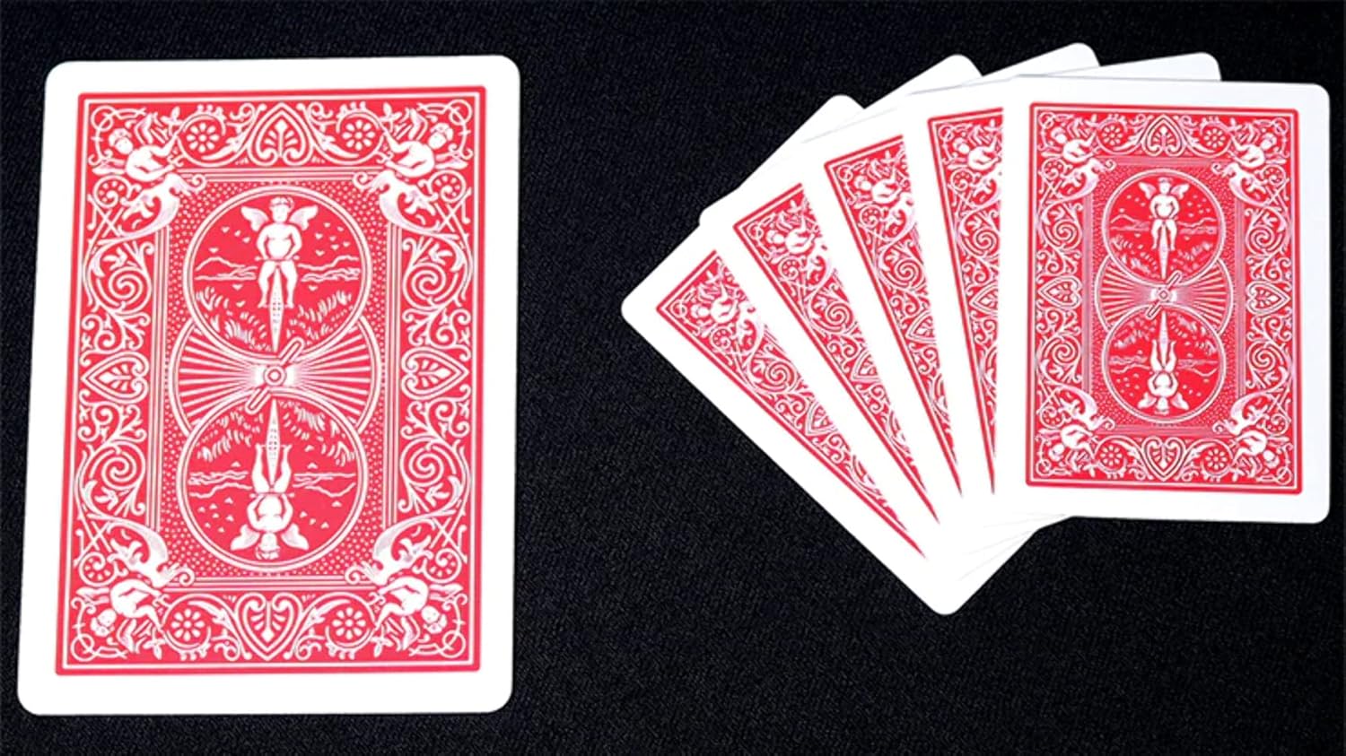 Red Bicycle mini playing cards with a rider back design on a black background