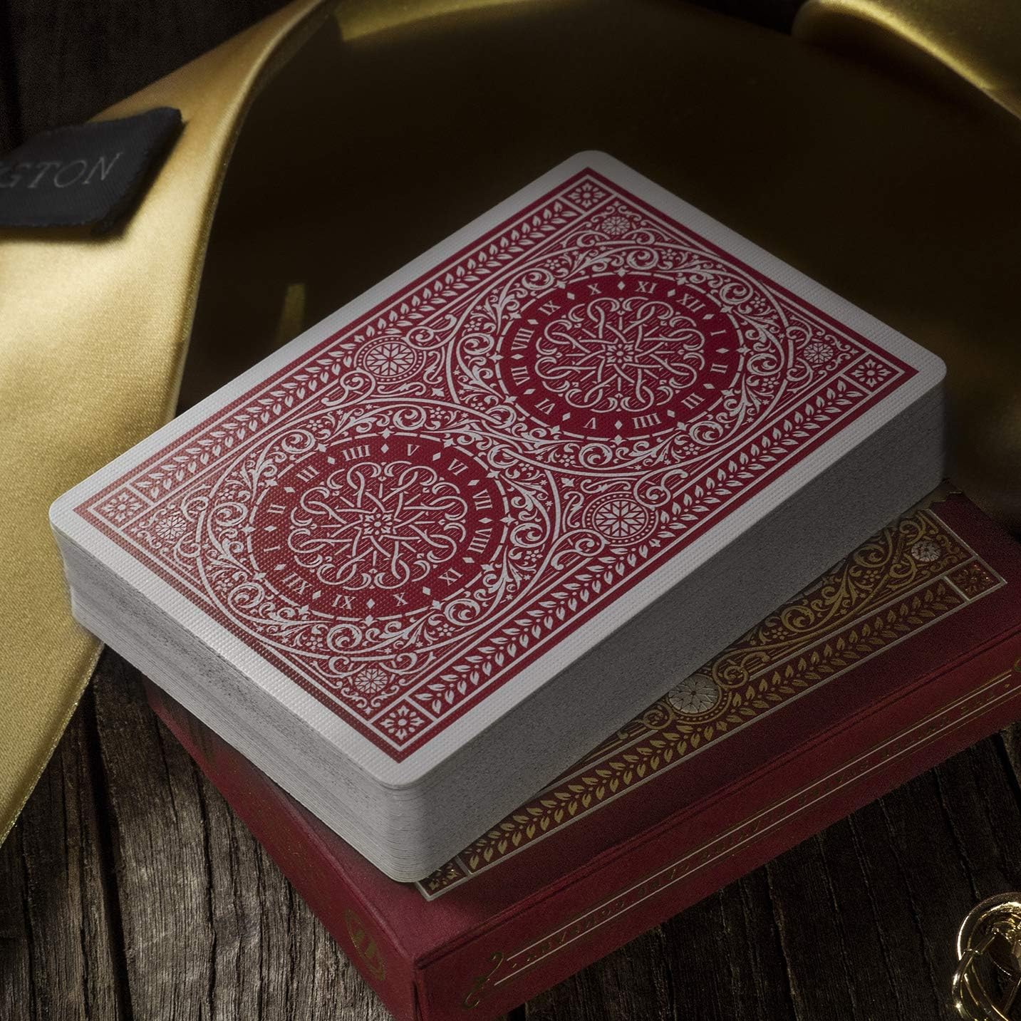Stack of playing cards with decorative design on a wooden surface