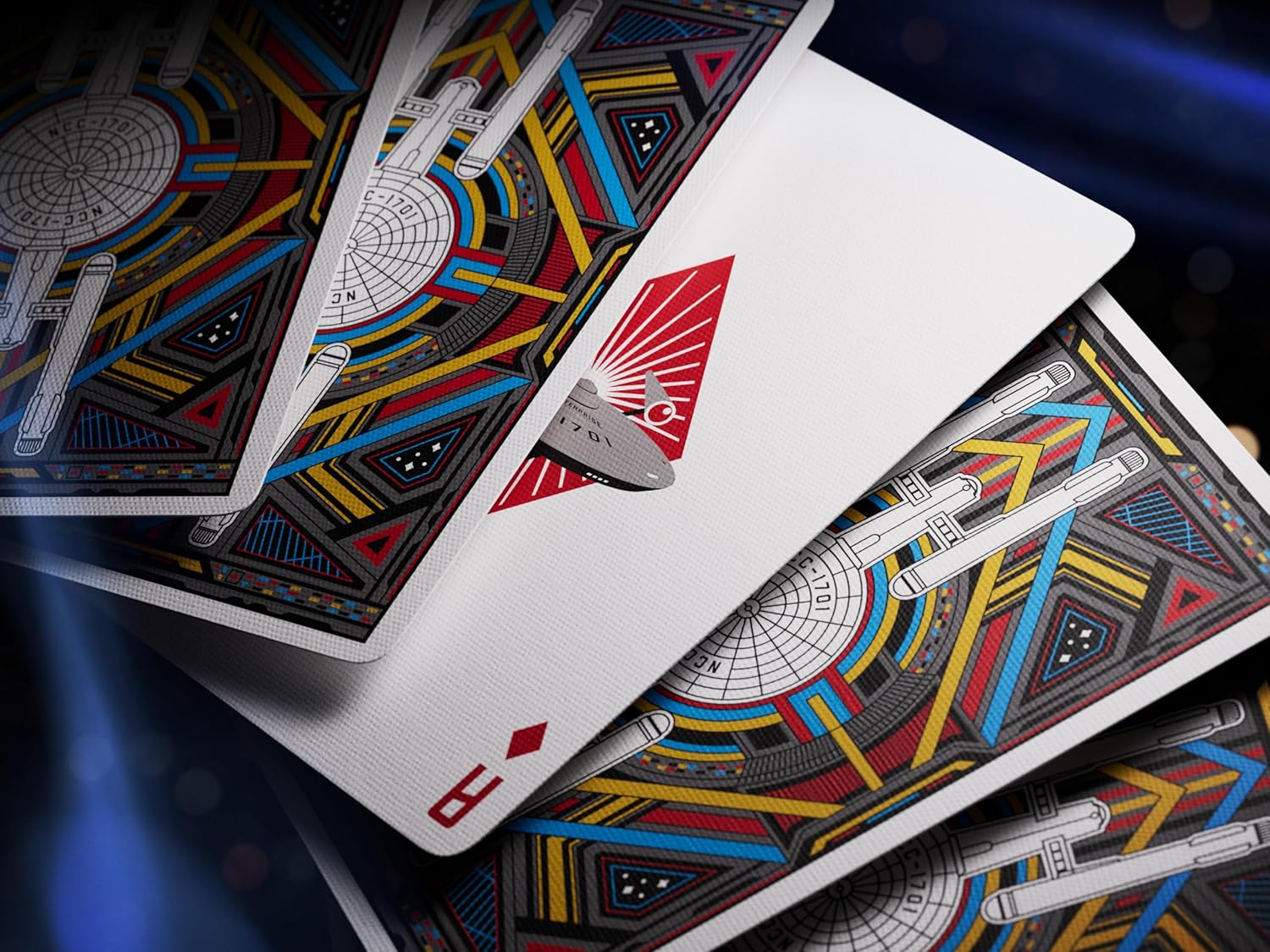 Playing cards with futuristic design on a dark background