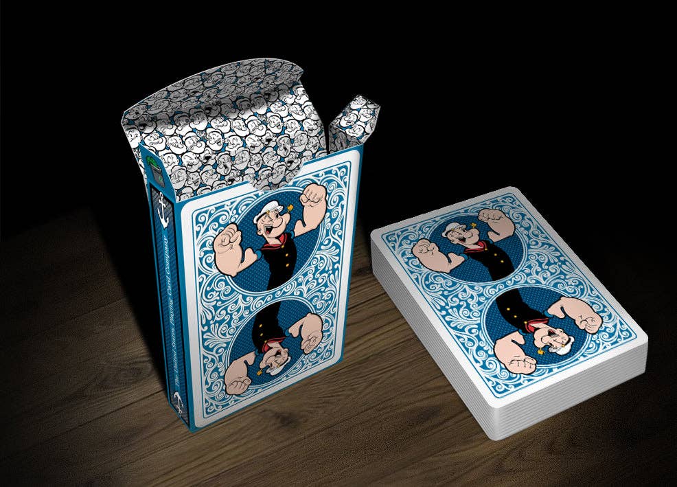 Playing cards with cartoon character Popeye design on a wooden surface