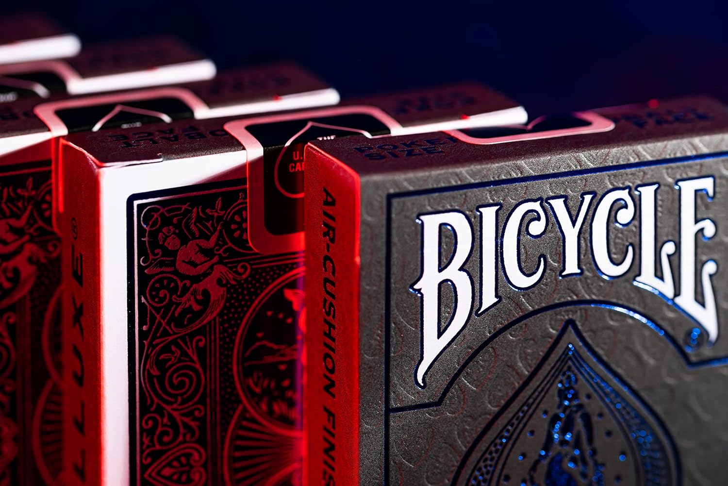 Close-up of Bicycle Cobalt Metalluxe playing cards with red and black design