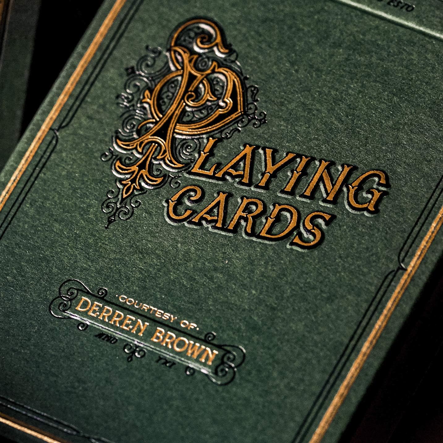Detail of embossed ‘Playing Cards – Courtesy of Derren Brown’ text on green tuck front.