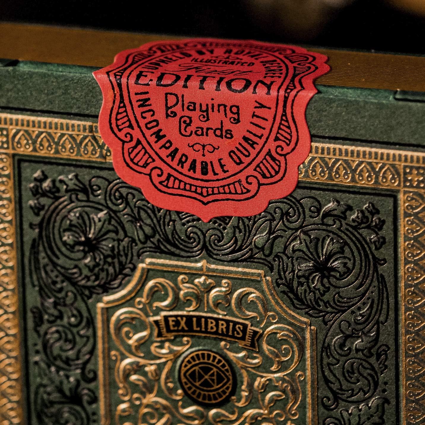 Red vintage-style seal on top of Derren Brown tuck with embossed lettering.”