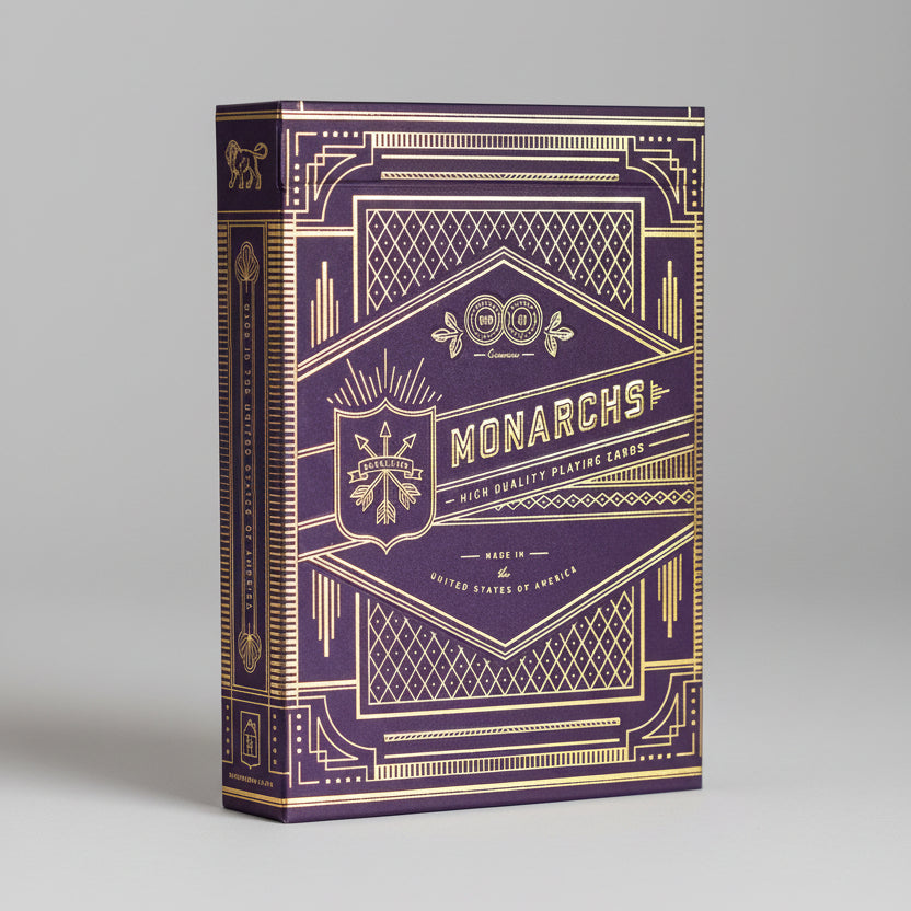 Purple and gold playing card box with 'Monarchs' branding
