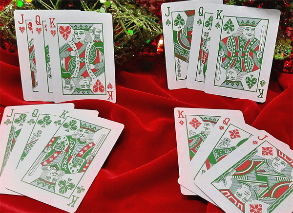 Playing cards with kings on a red fabric background
