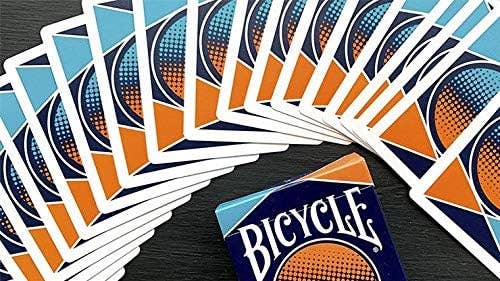 Fanned-out deck of Bicycle playing cards on a dark surface