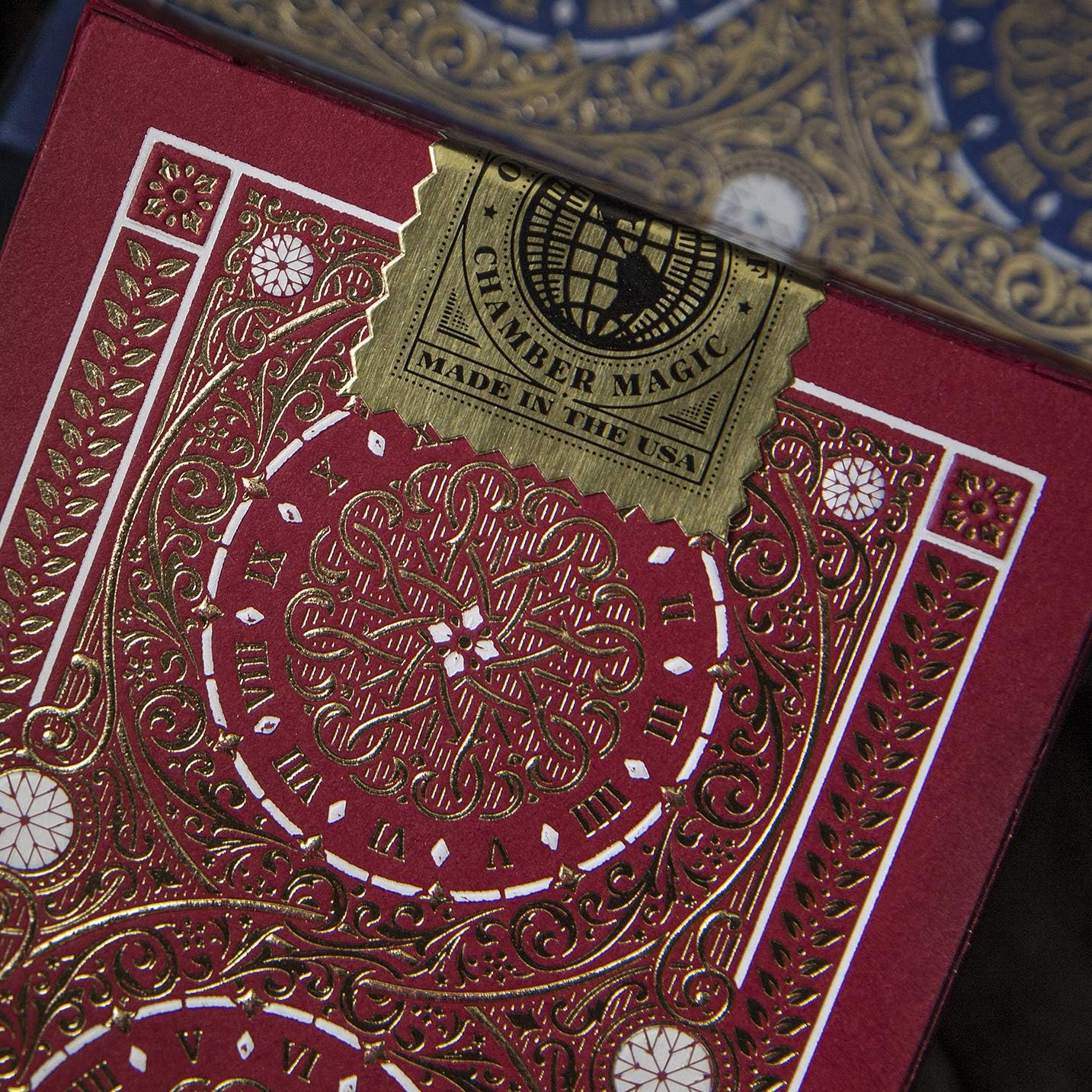 Close-up of a deck of playing cards with intricate designs and 'Chamber Magic' branding.