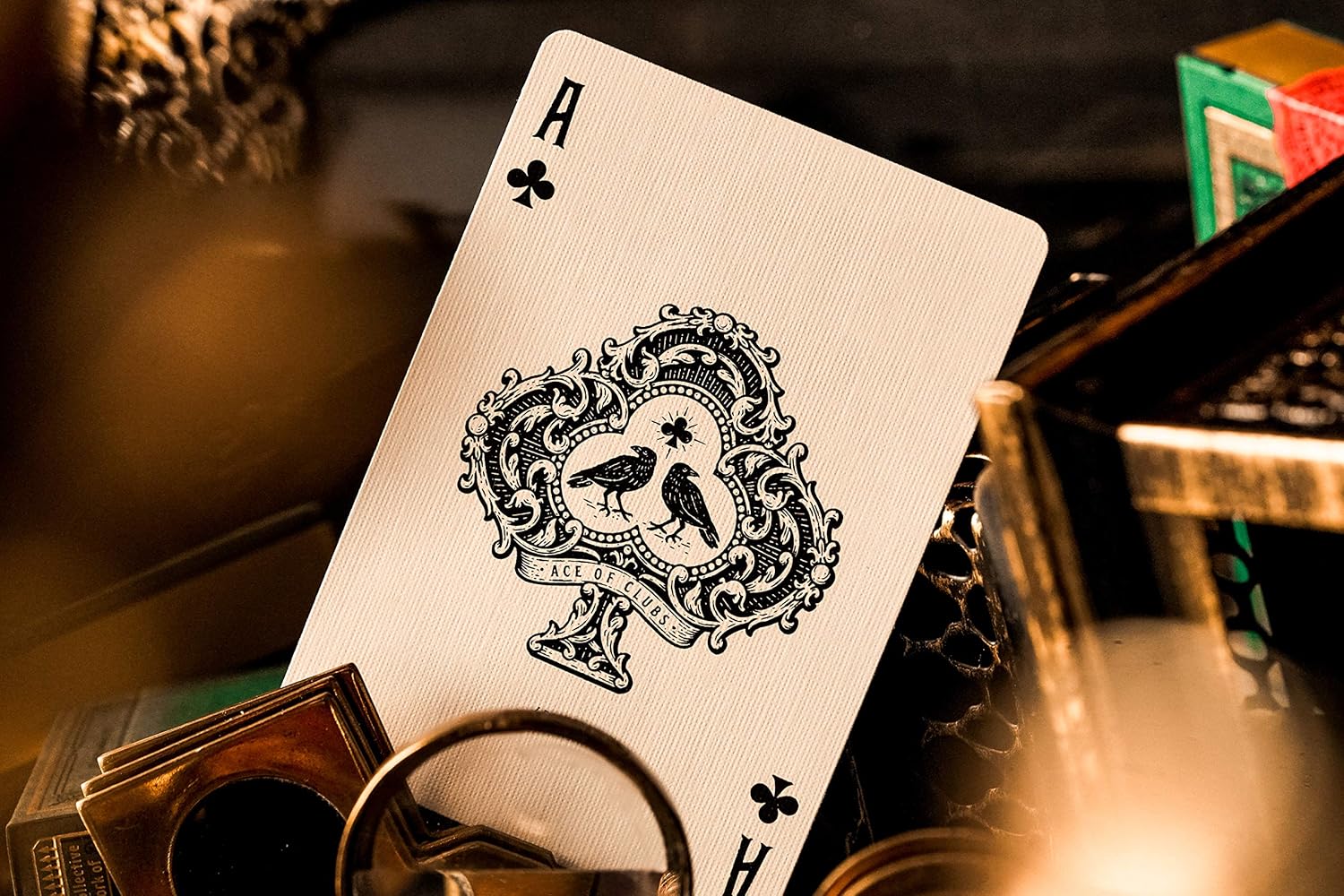 Ace of clubs from Derren Brown deck showing two ravens inside an elaborate club-shaped cartouche.