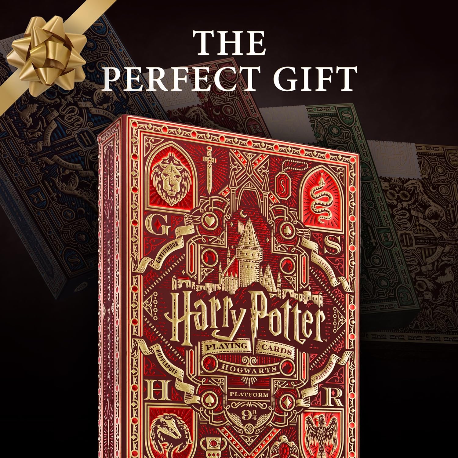 Red and gold Harry Potter playing card box with decorative elements on a dark background