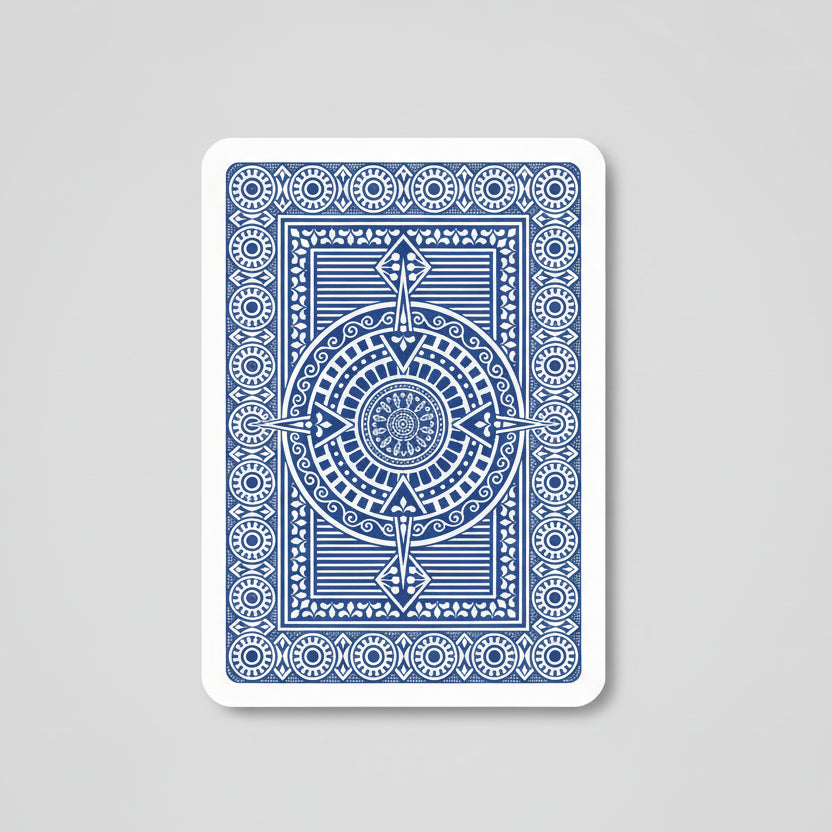 Blue playing card with intricate design on a white background