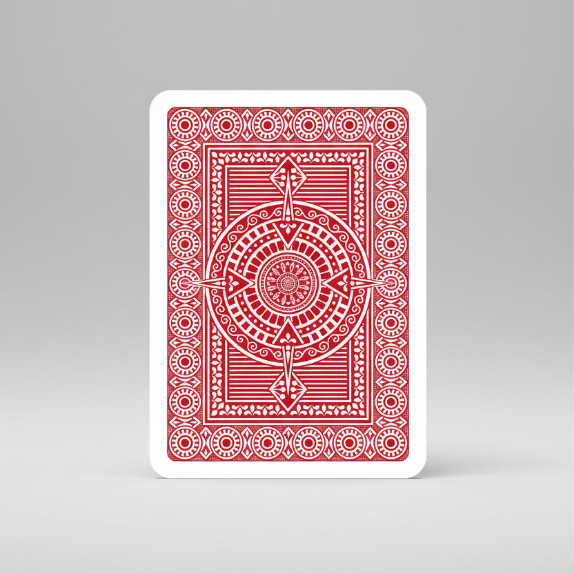 Red playing card with a geometric design on a white background