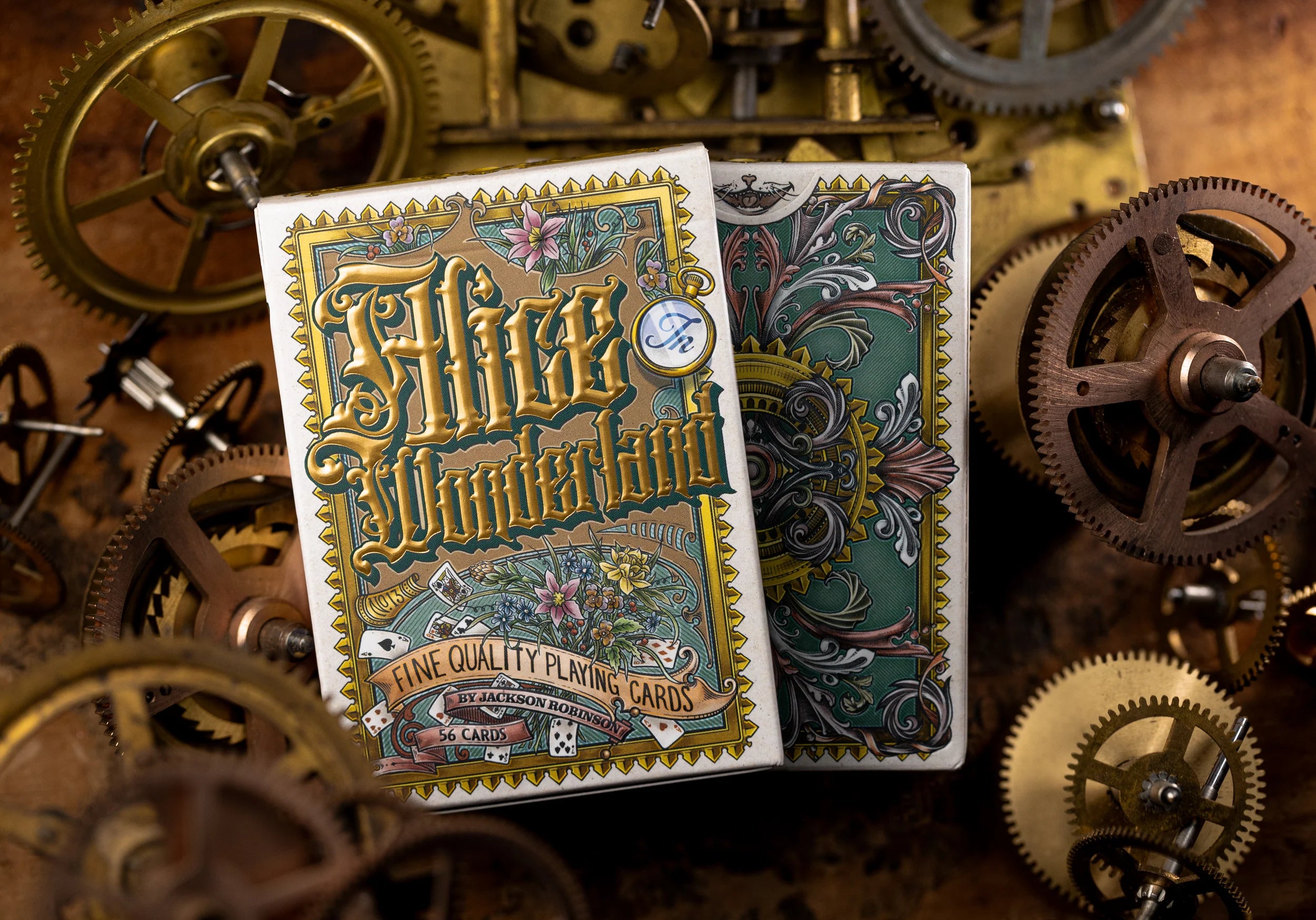 Playing cards with 'Alice in Wonderland' design on a background of mechanical gears.