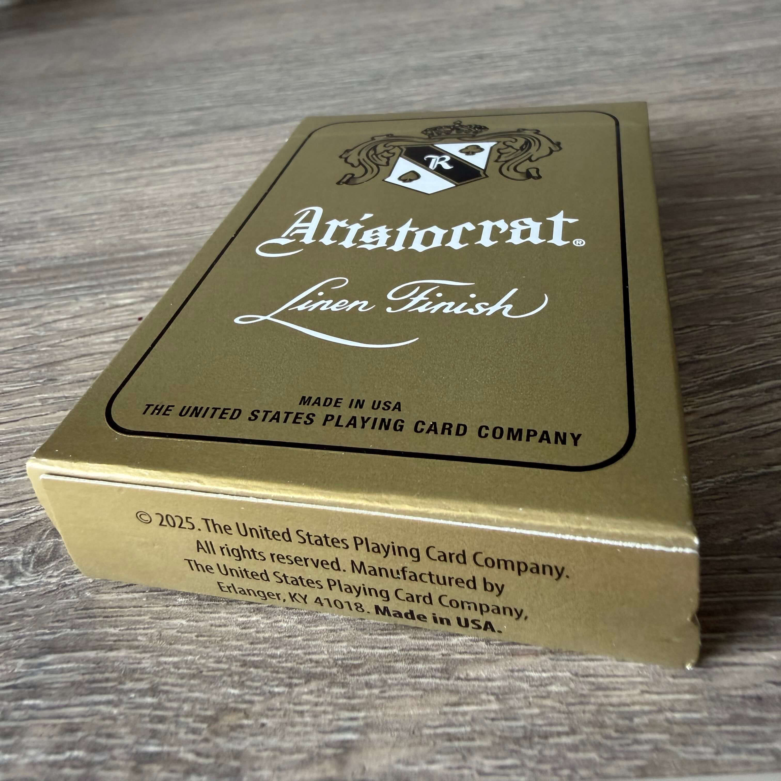 Front of Aristocrat 727 Gold tuck box close-up with view of tuck bottom