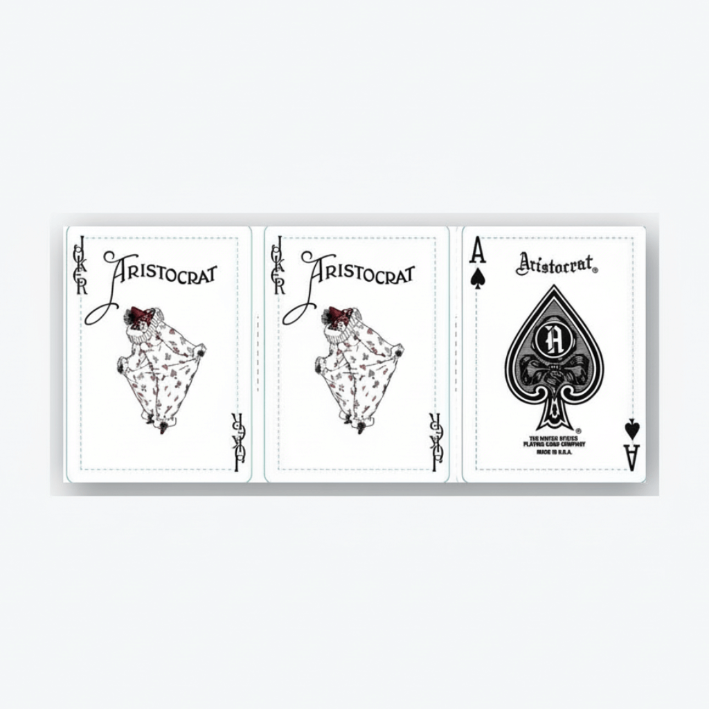 Three playing cards from the Aristocrat 727 110th Anniversary deck on a white background