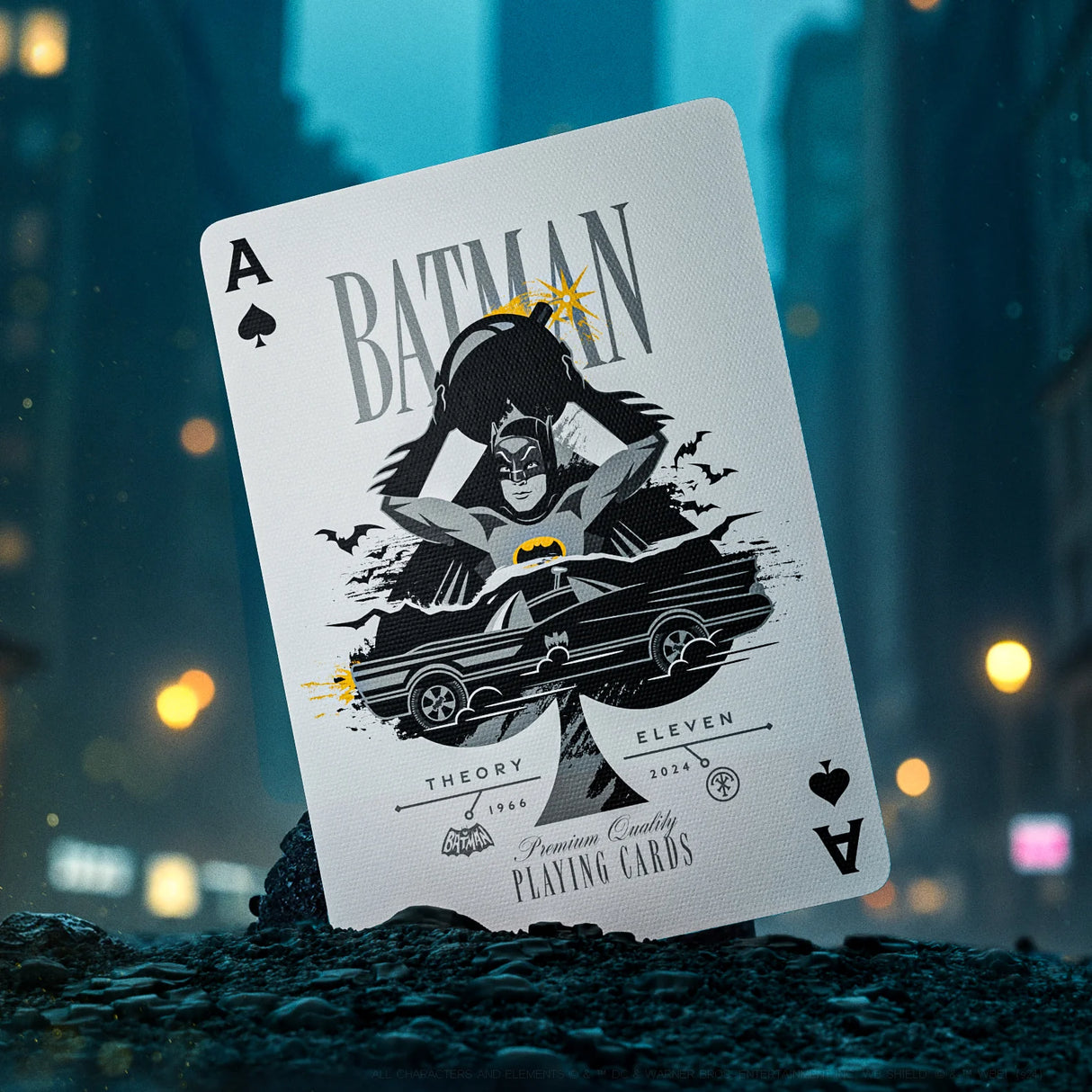 Playing card with Batman design on a blurred city street background