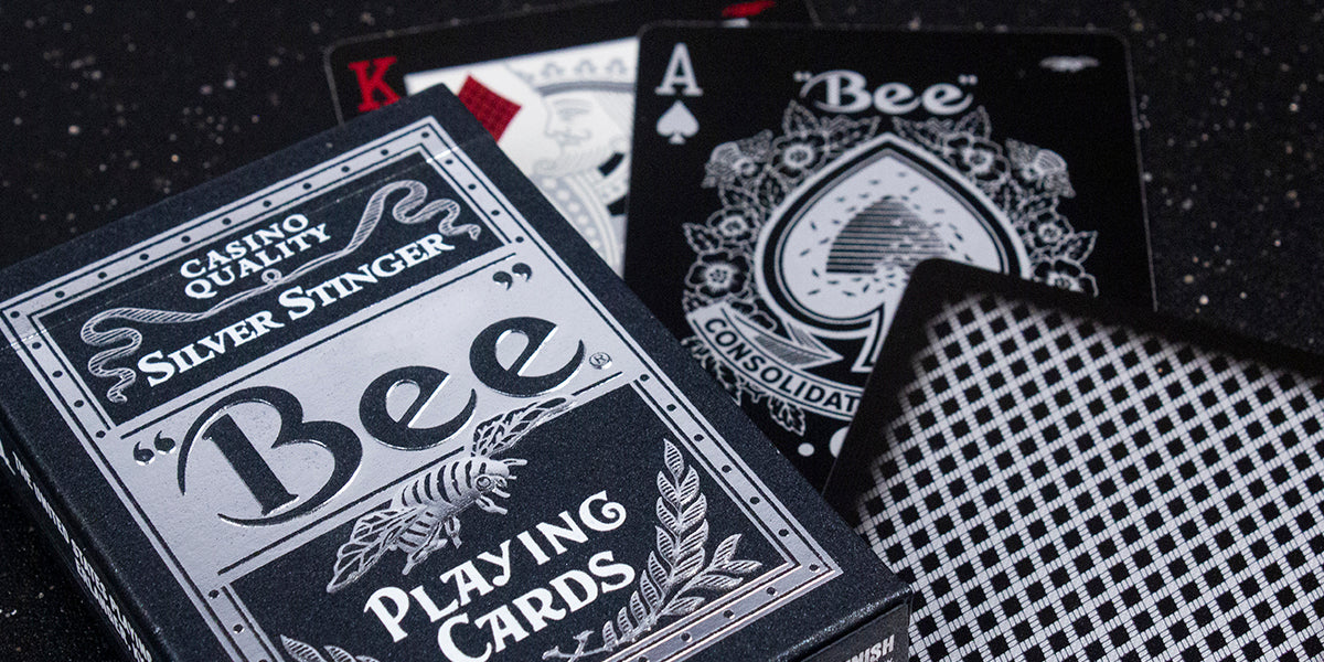 Bee playing cards with 'Silver Stinger' branding on a dark background
