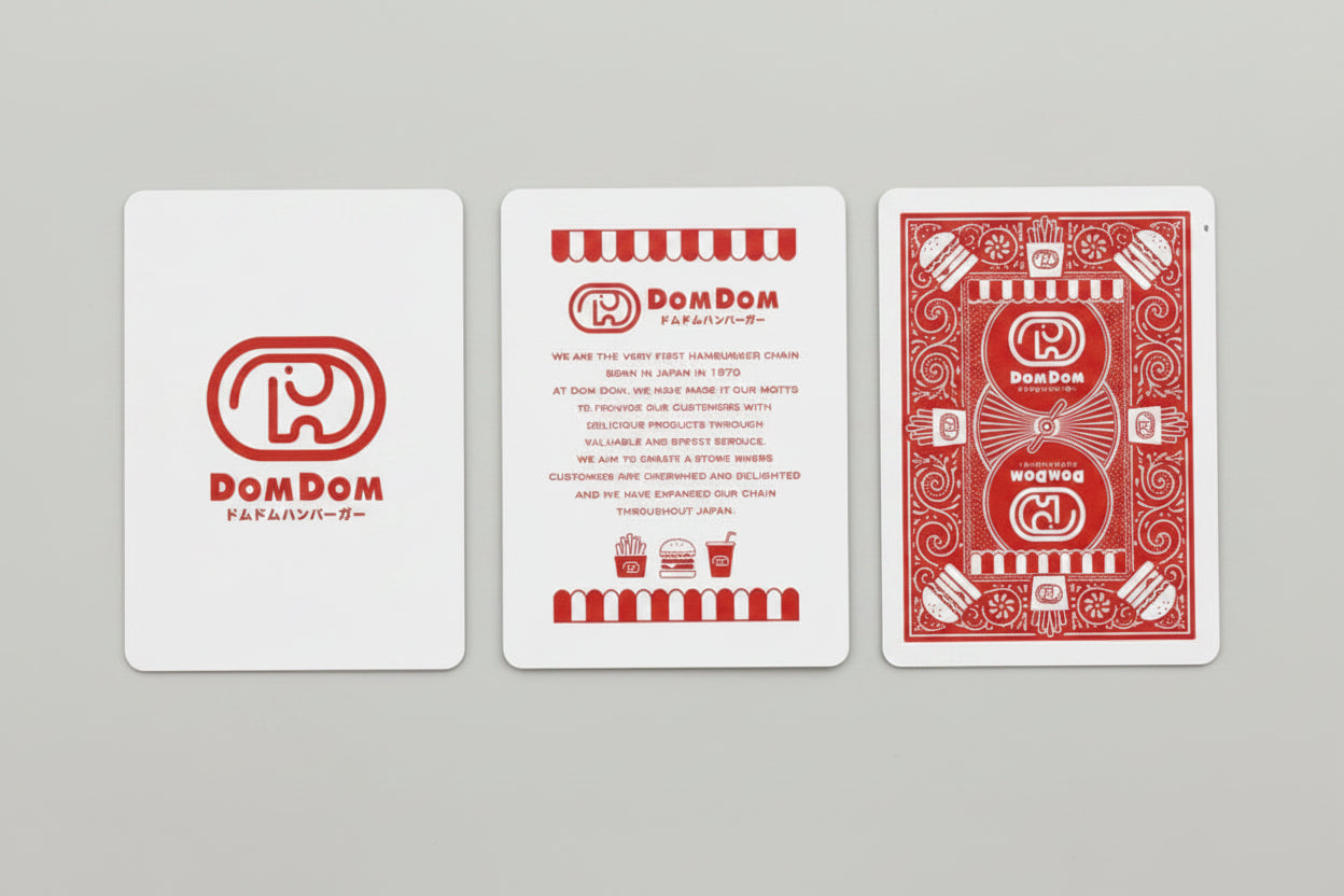 Bicycle Dom Dom Burger Playing Cards with Dom Dom logo card, branded information card, and custom red back design