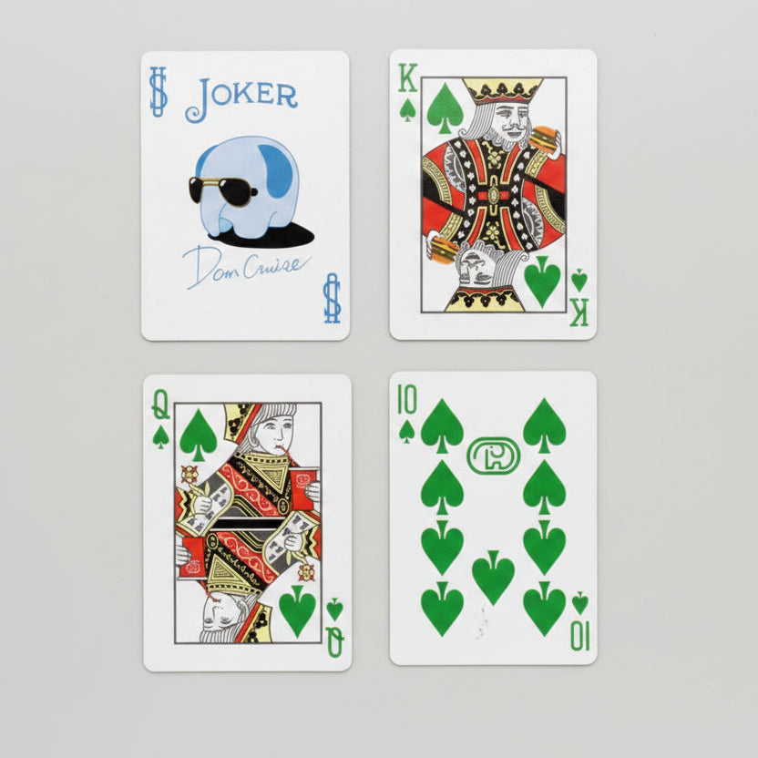 Bicycle Dom Dom Burger Playing Cards showing custom jokers, four-color suits, and branded face cards inspired by the Japanese burger chain