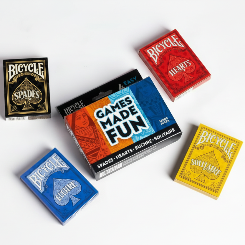 Four Bicycle playing card decks in different colors on a white background