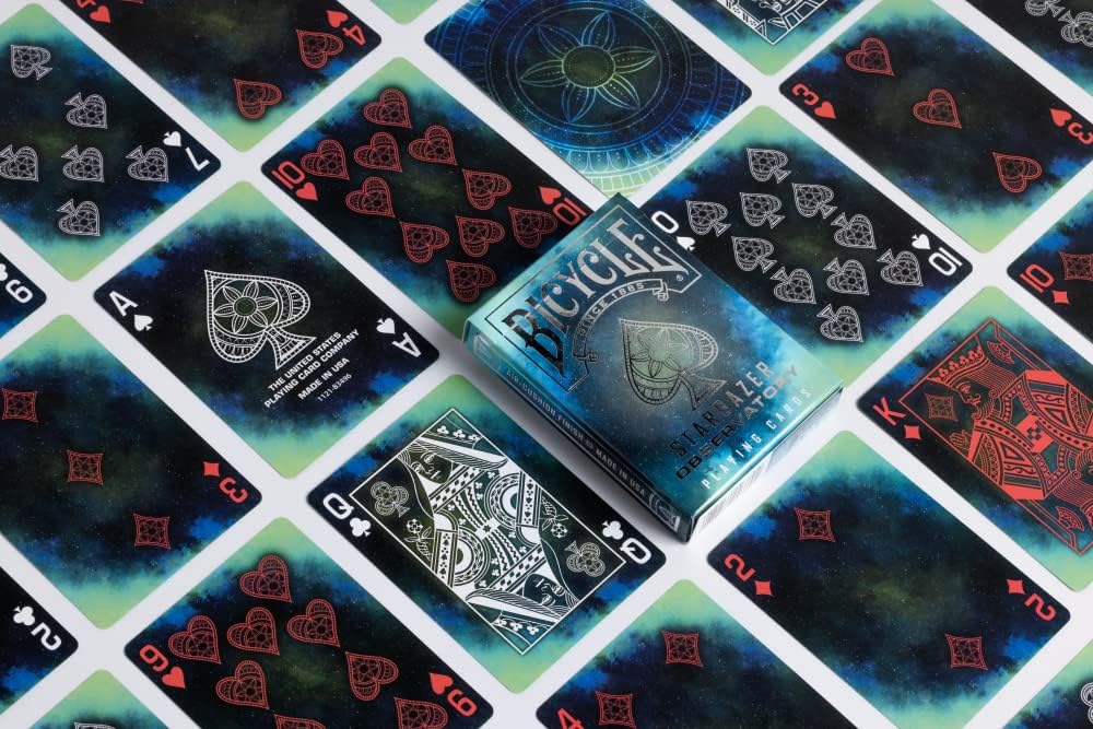 Playing cards with a blue and black gradient design on a matching card.