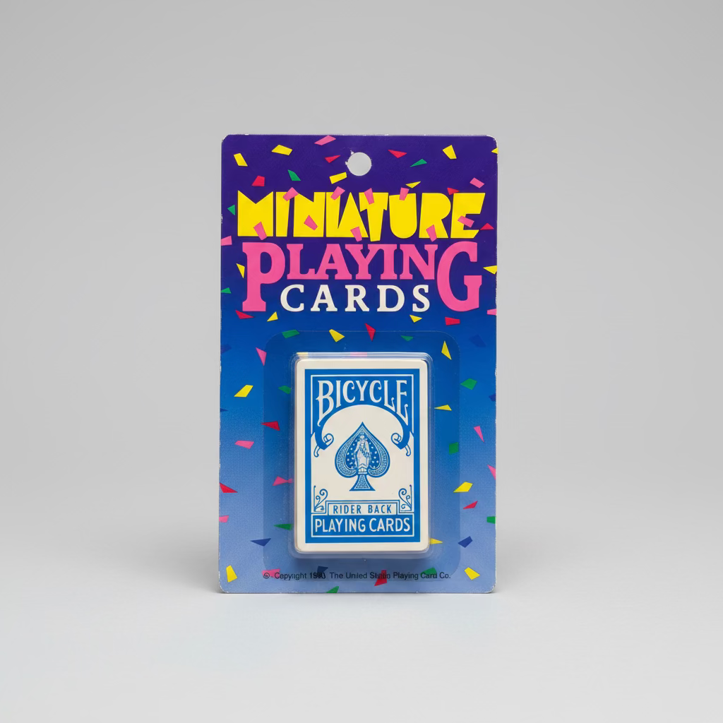 Bicycle miniature playing cards in their original blue cardboard blister packaging from 1990, displayed on a studio.