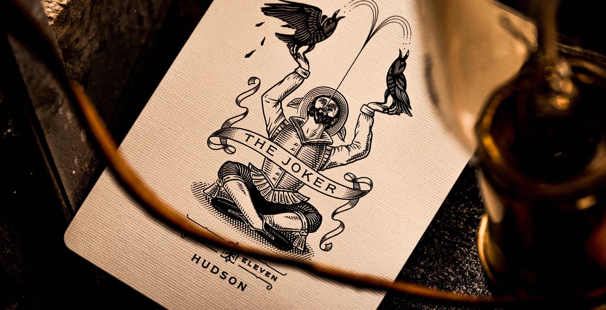 Theory11 Black Hudson Joker card with bird illustration