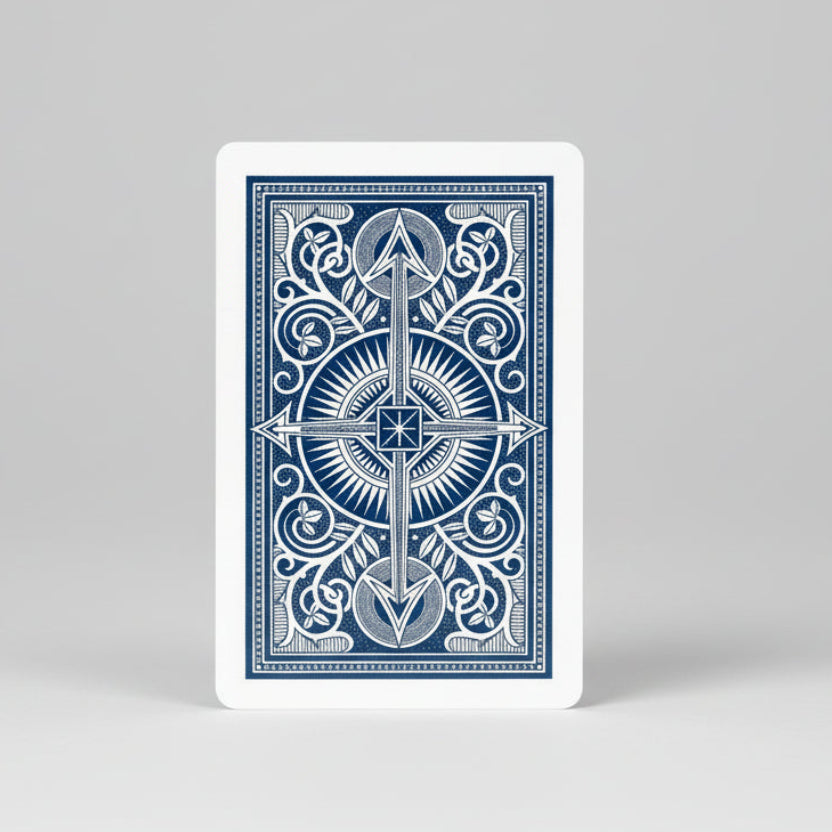 Blue KEM playing card with decorative design on a white background