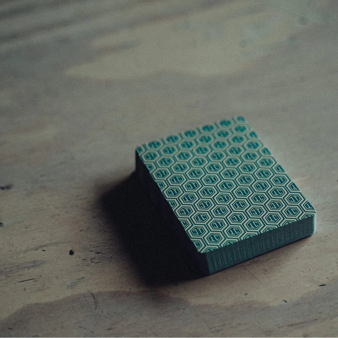 Green and black patterned NO BORDERS: Series 1 box on a wooden surface