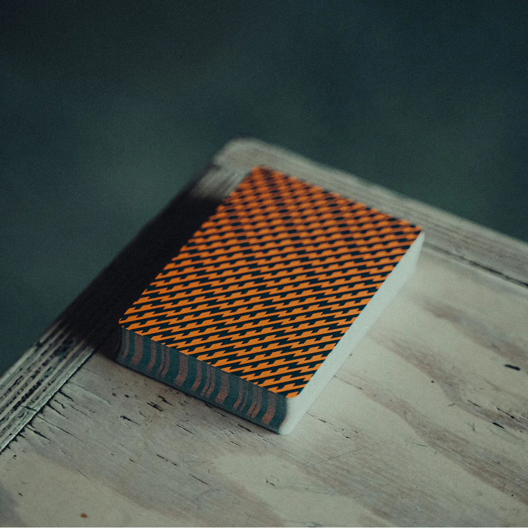 NO BORDERS: Series 1 lightning deck with a geometric pattern on a wooden surface