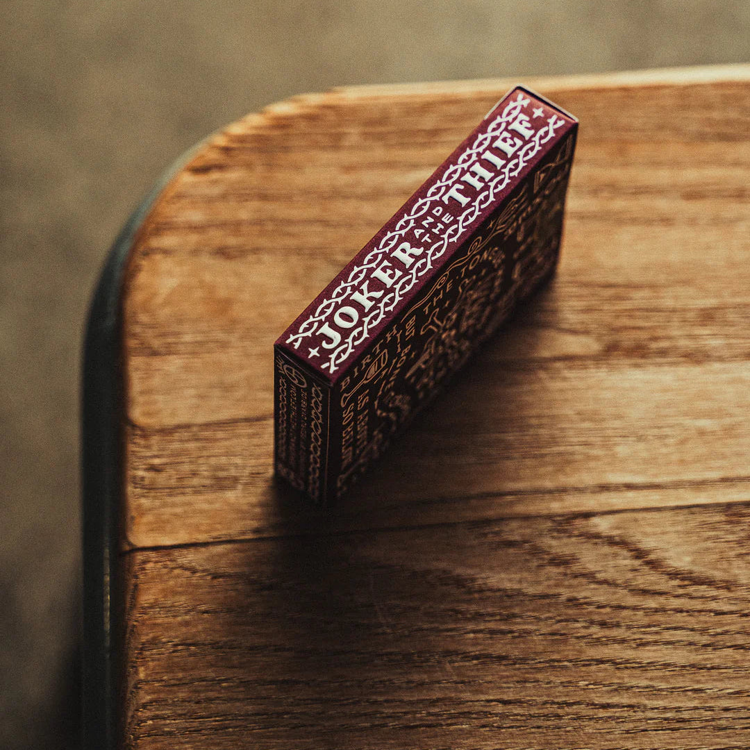 Decorative Crown: Royal Purple Edition box with intricate patterns on a wooden surface