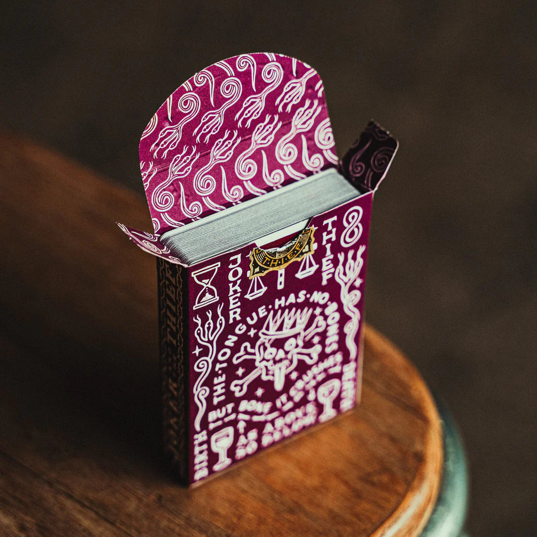 Decorative Crown: Royal Purple Edition box with intricate designs on a wooden surface