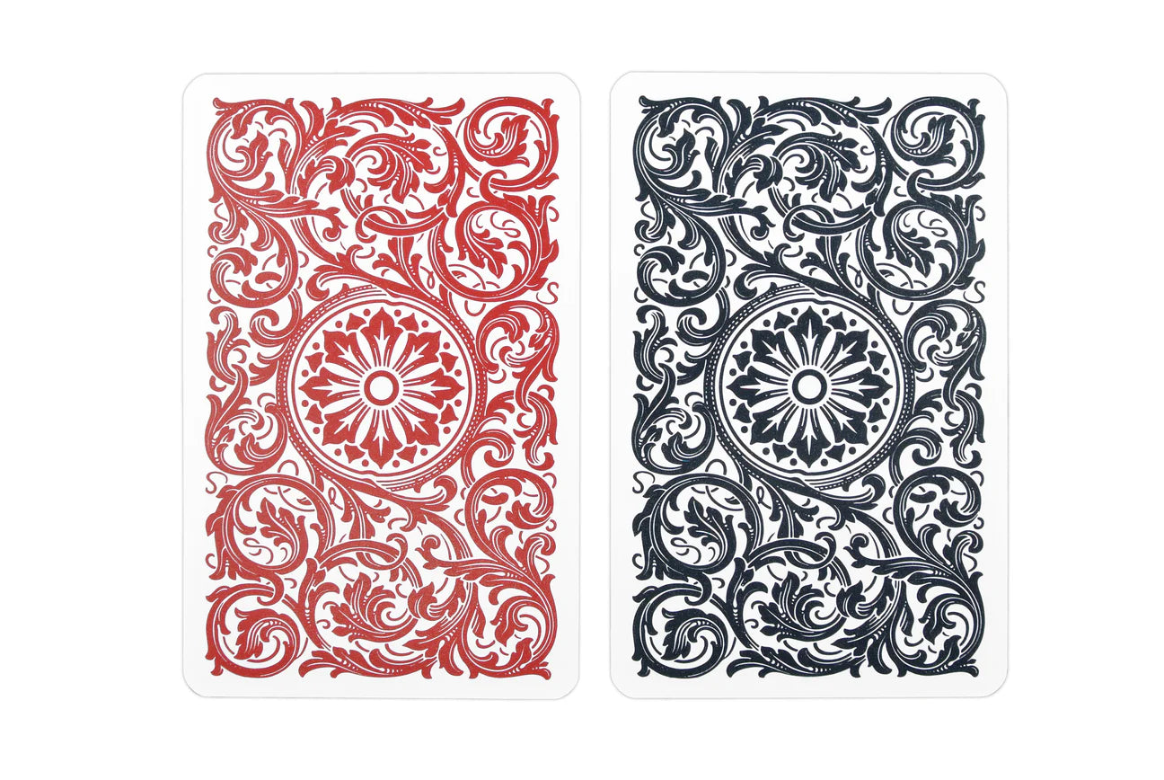 Two Copag 1546 Bridge Size Jumbo Index (Black & Red) with red and black intricate patterns on a white background