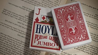 Hoyle playing cards on an open book
