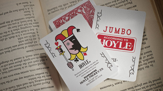 Playing cards with 'According to Hoyle' branding on an open book