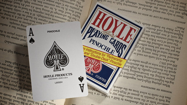 Hoyle playing cards with an Ace of Spades card and packaging on a textured surface.