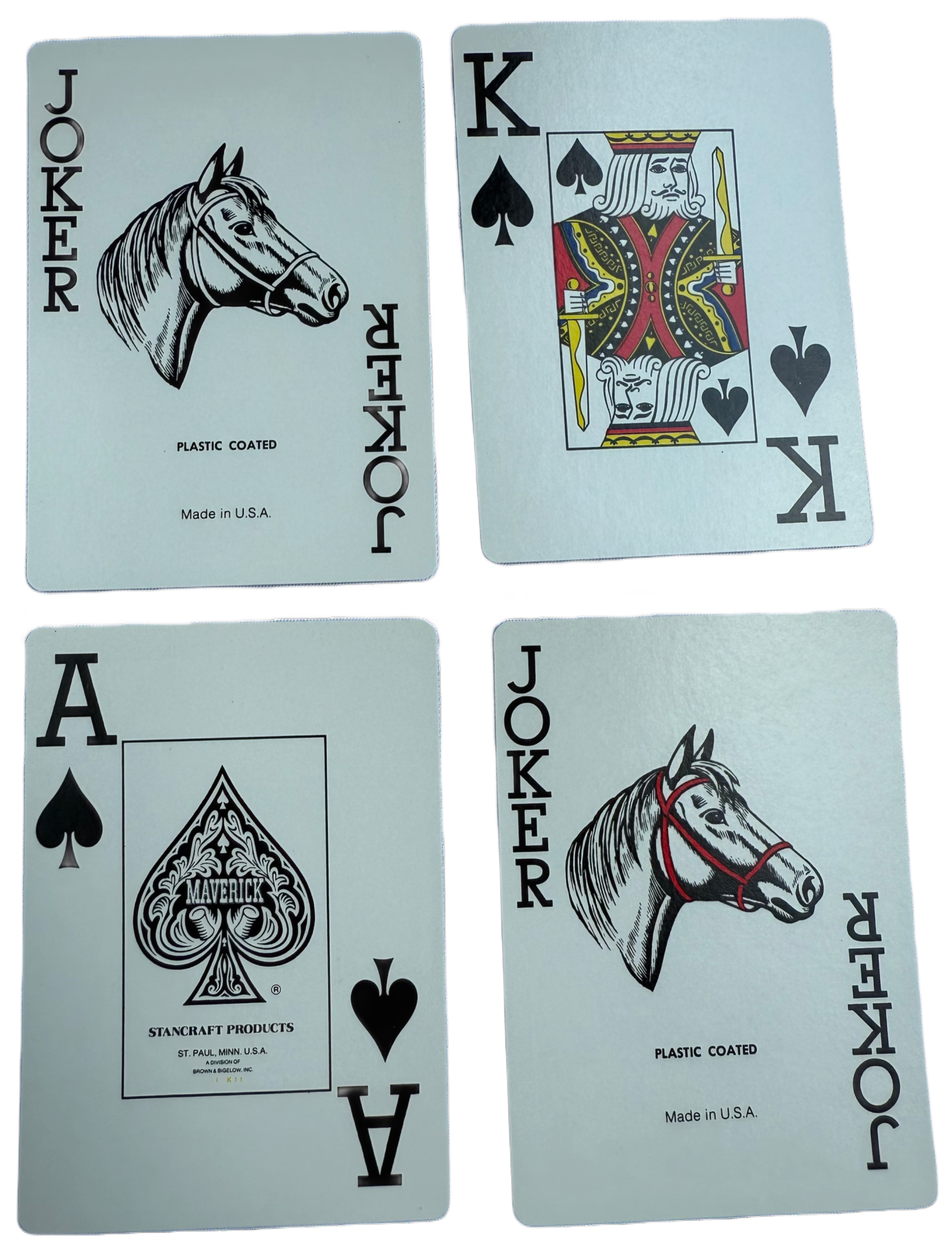 Four playing cards with Joker, King of Spades, Ace of Spades, and Joker on a light blue background.