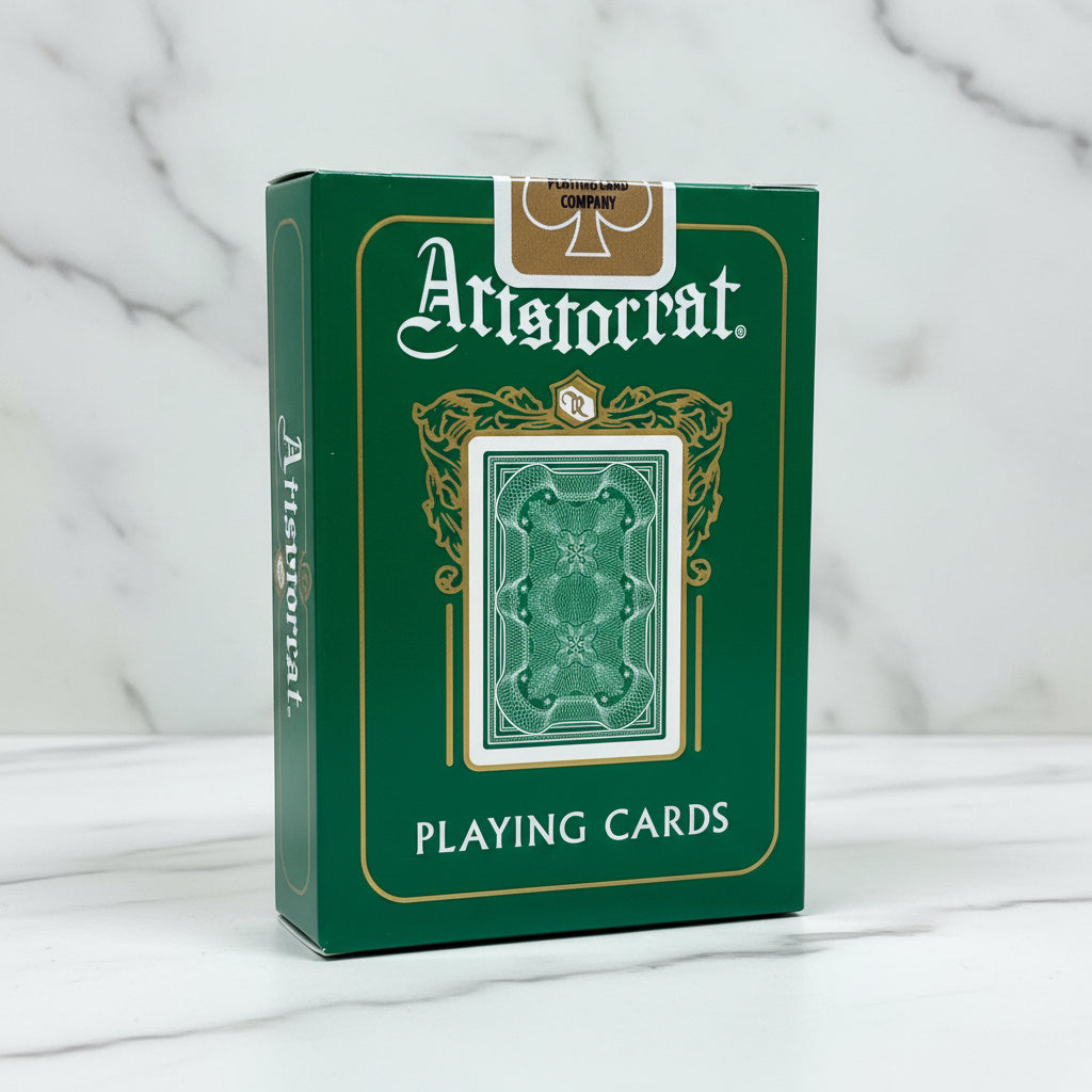 Currency green box of Aristocrat playing cards on a marble surface