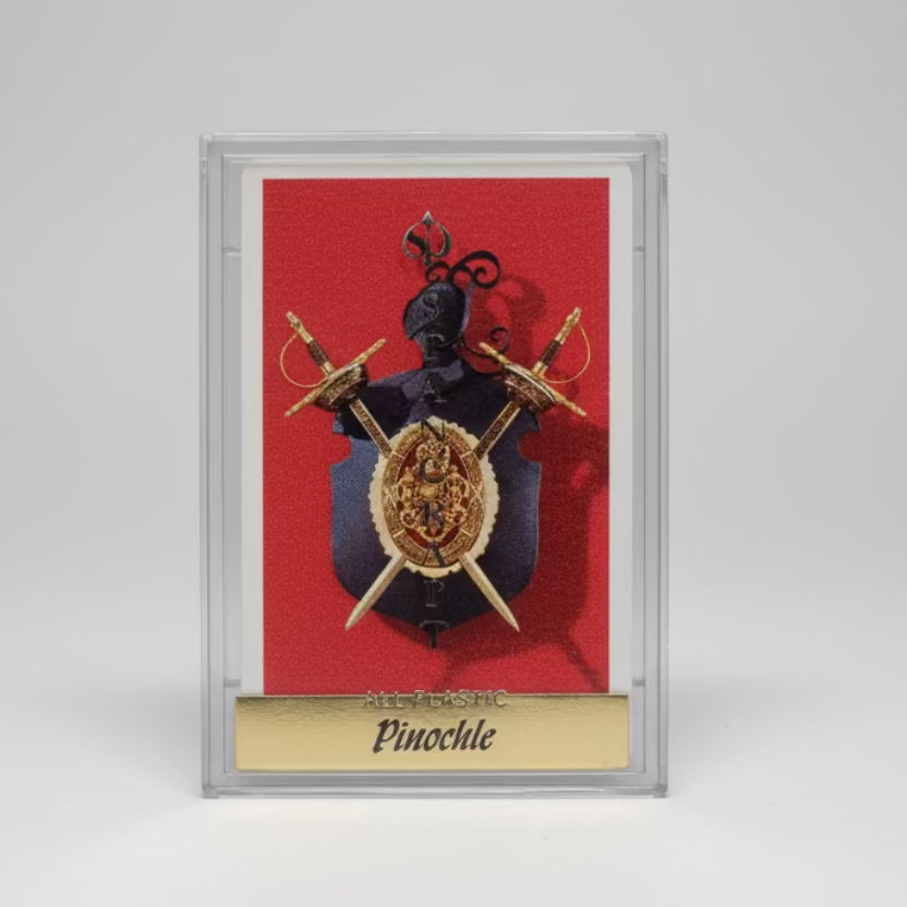 Stancraft pinochle playing card with swords on a red background, encased in clear plastic.