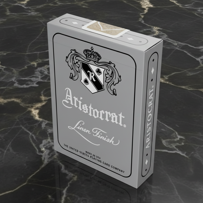 Aristocrat silver 727 playing card box with branding and design elements on a dark marble background